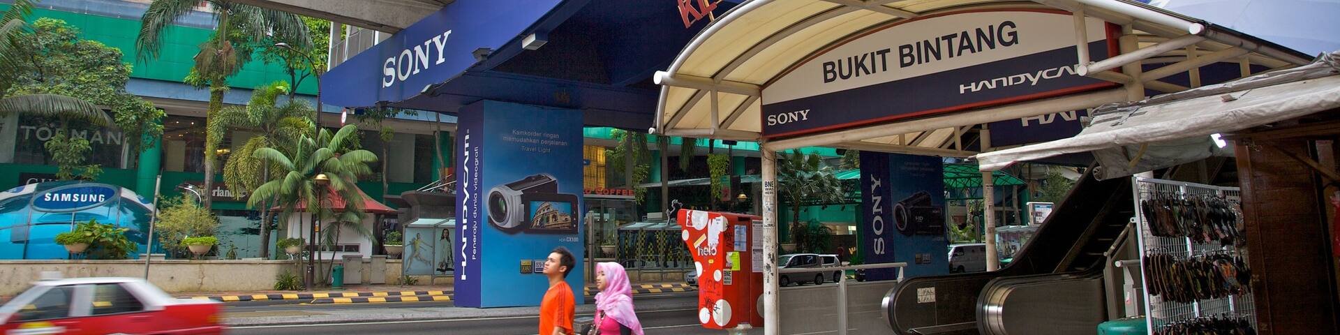 Bukit Bintang Plaza featuring street scenes and a city as well as a couple