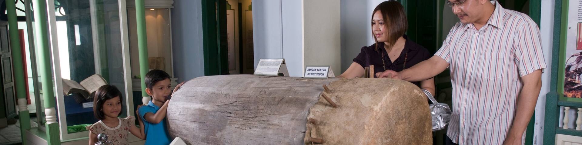 Penang Islamic Museum featuring interior views as well as a family