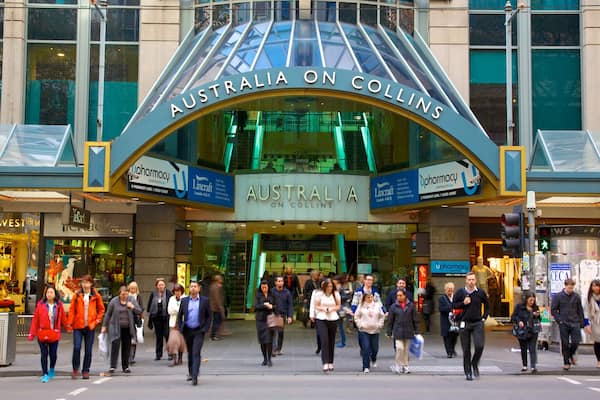 Collins Street which includes a city, modern architecture and street scenes