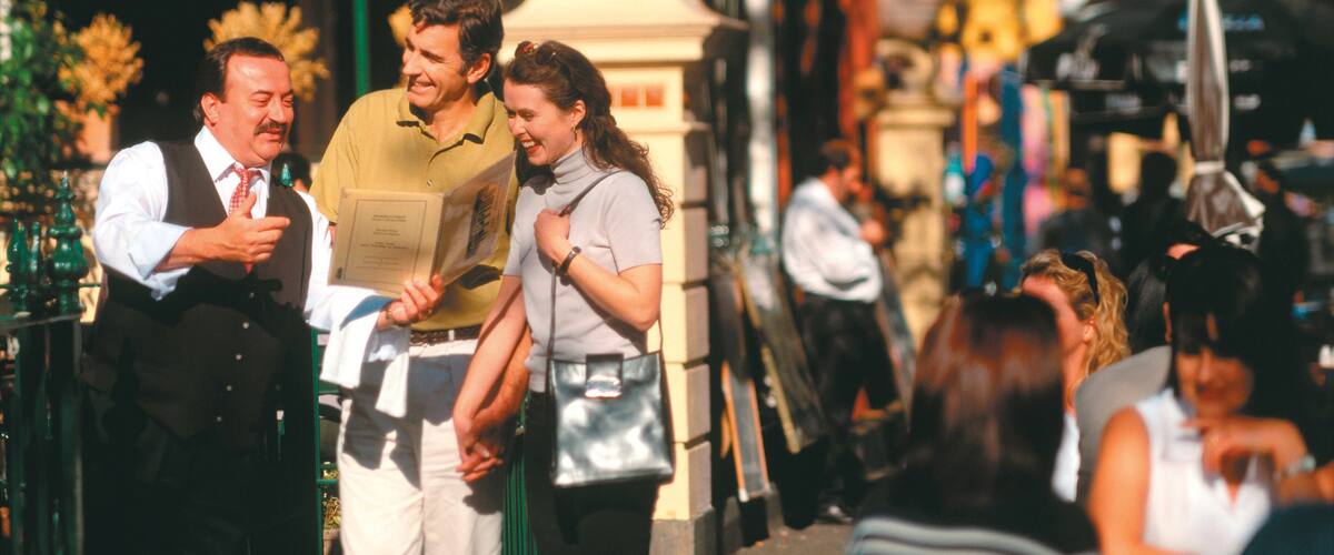 Lygon Street featuring street scenes and a city as well as a small group of people