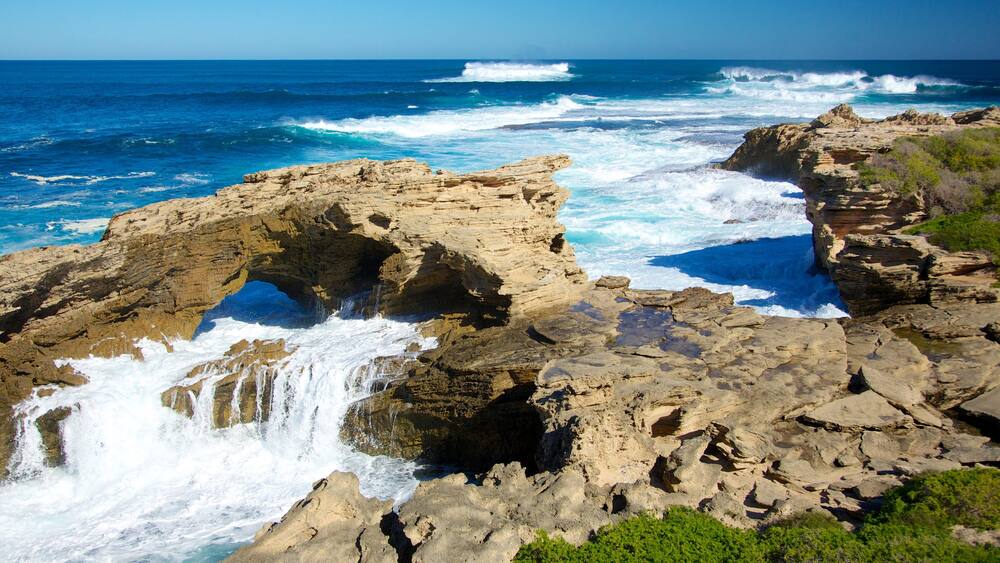 Western Australia featuring surf, rocky coastline and caves