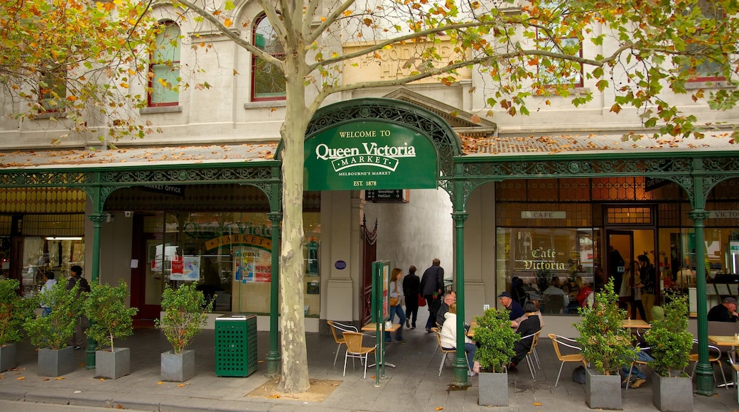 Queen Victoria Market que incluye señalización, mercados y escenas urbanas