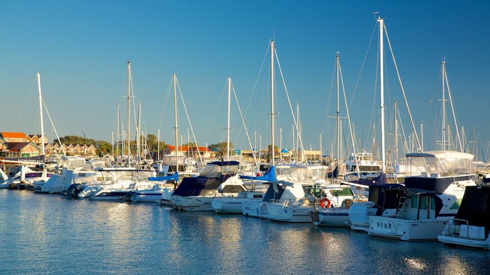 Hillarys Boat Harbour featuring a bay or harbor, a coastal town and boating