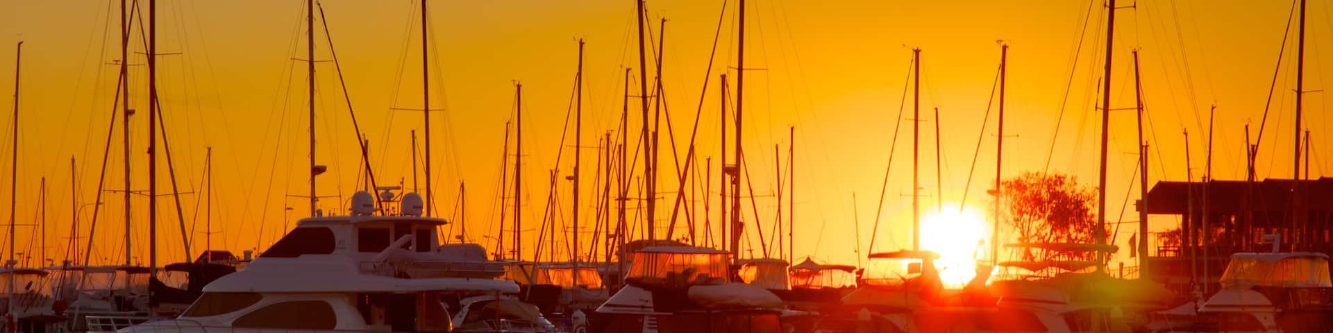 Hillarys Boat Harbour featuring a bay or harbor, a sunset and boating