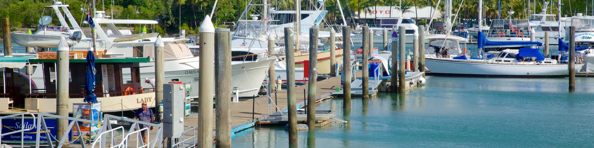 Marina Mirage which includes a coastal town, a marina and boating