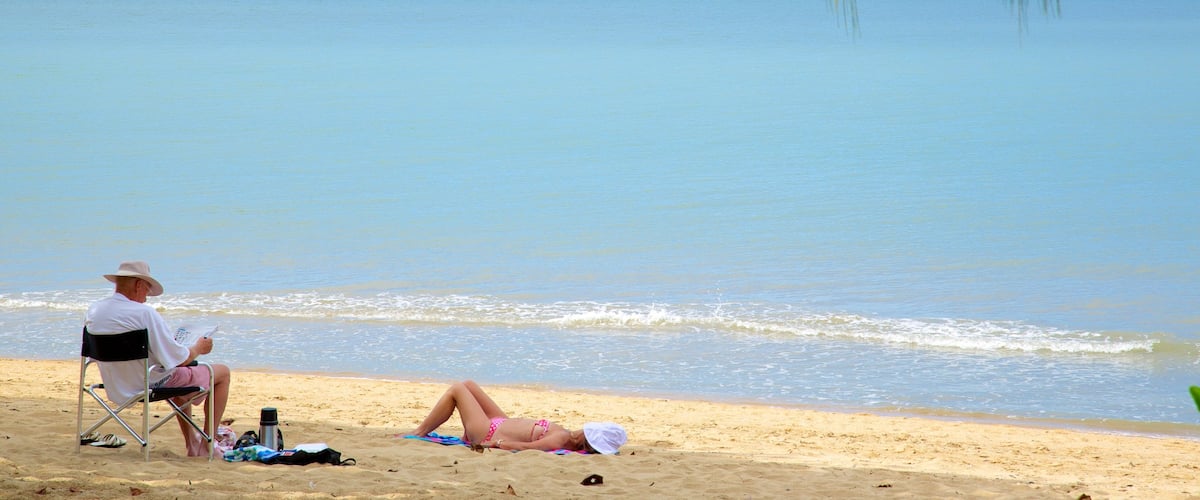 Palm Cove Beach featuring landscape views, a sandy beach and tropical scenes