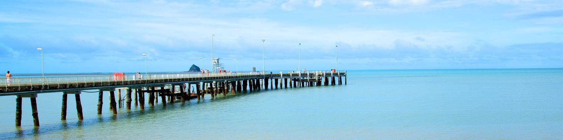Palm Cove Beach featuring skyline, a sandy beach and landscape views