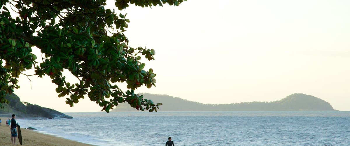 Trinity Beach featuring tropical scenes, landscape views and surfing
