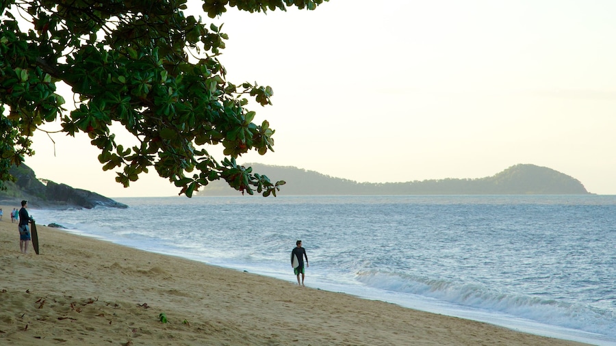 Trinity Beach which includes a sandy beach, landscape views and surfing