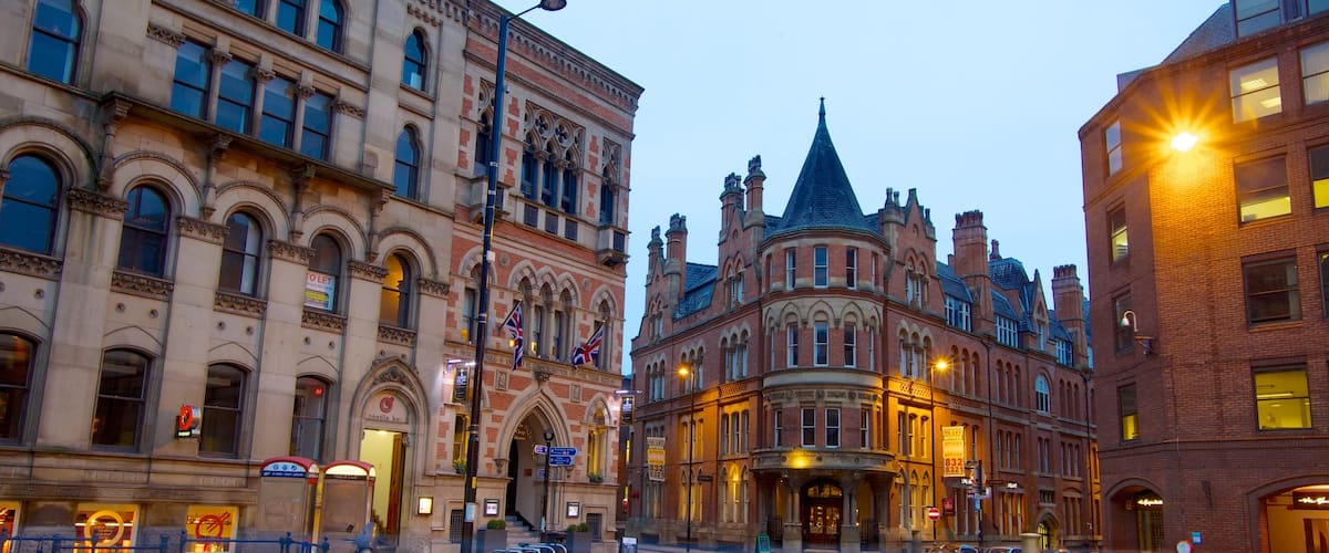 Albert Square which includes a city, street scenes and a square or plaza