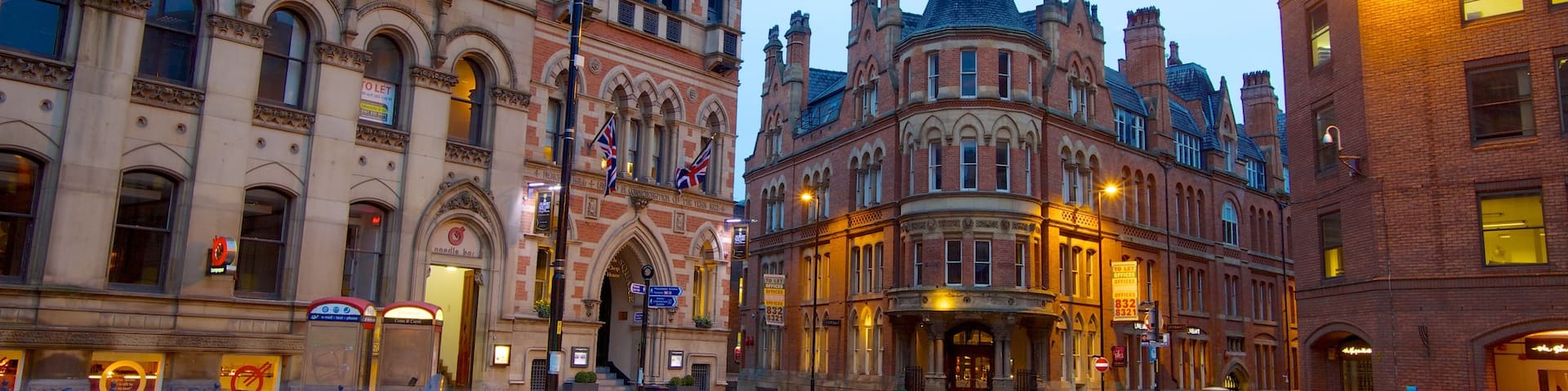 Albert Square which includes a city, street scenes and a square or plaza