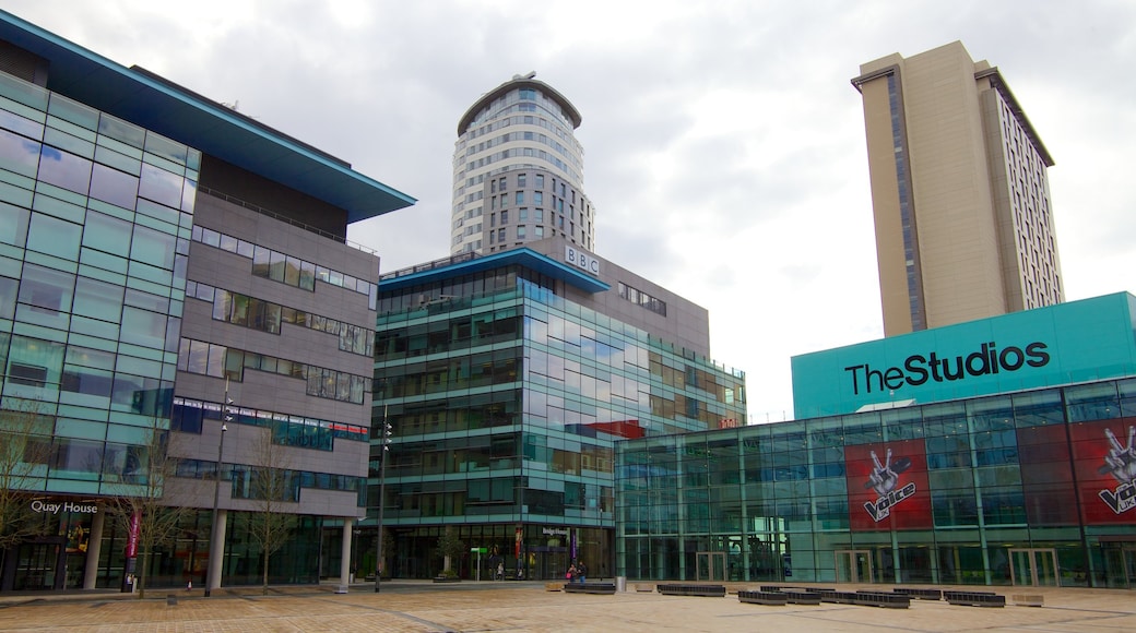 MediaCityUK featuring a square or plaza, signage and theatre scenes