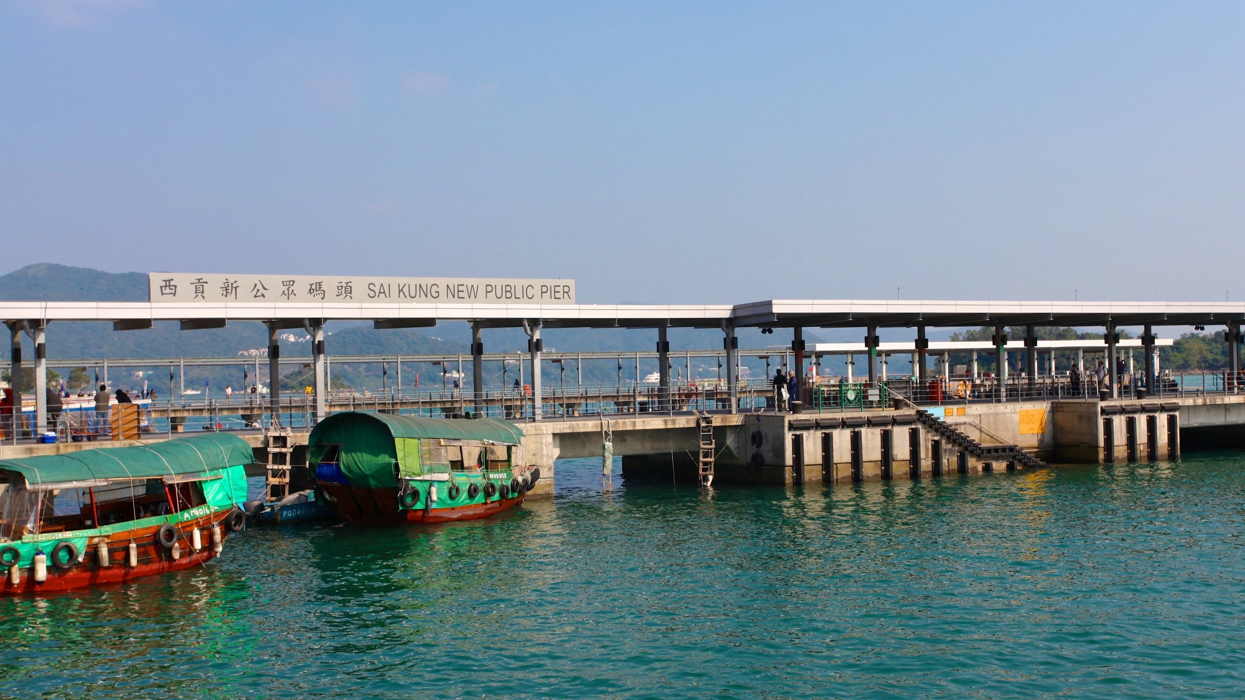 Sai Kung which includes a bay or harbor, general coastal views and signage
