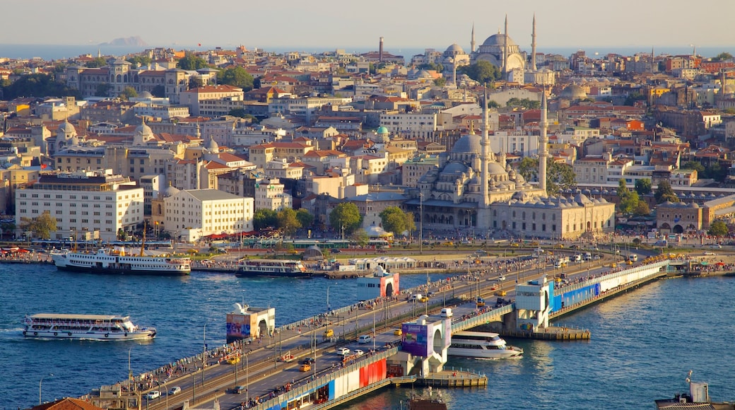 Galata Tower featuring a ferry, skyline and a river or creek