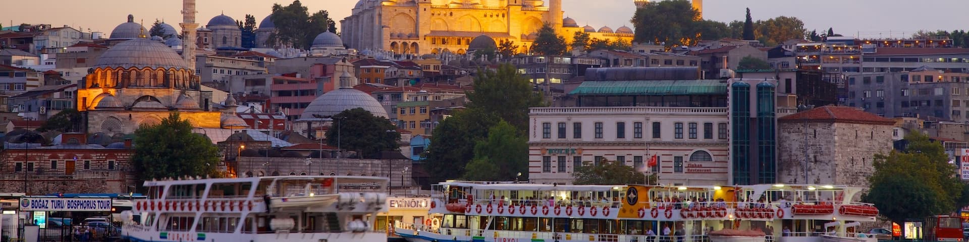 Rustem Pasha Mosque showing a ferry, a bay or harbor and a sunset