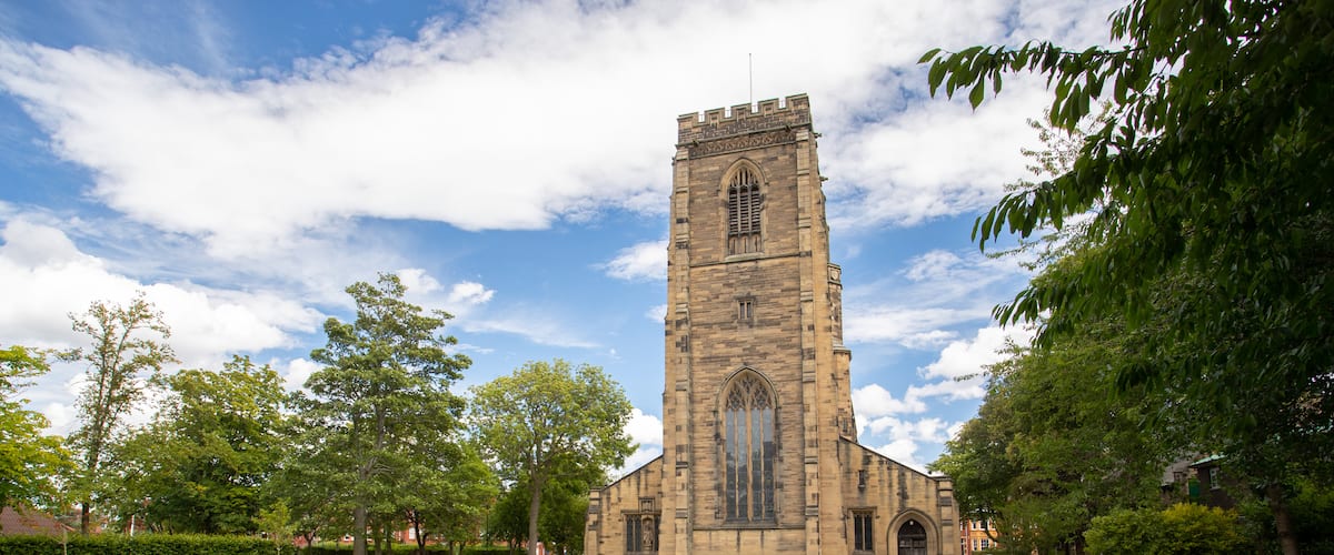 All Saints Church featuring heritage architecture and a church or cathedral