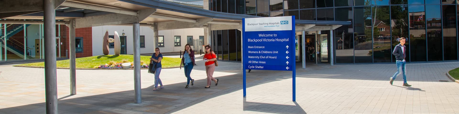 Victoria Hospital which includes signage and street scenes as well as a small group of people