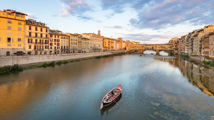 Ponte Vecchio showing boating and a river or creek