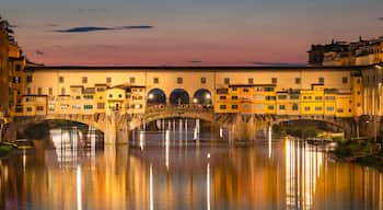 Arcetri which includes a river or creek, a sunset and a bridge