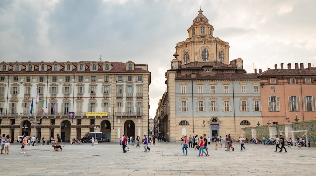 Piazza Castello which includes a square or plaza, street scenes and heritage architecture