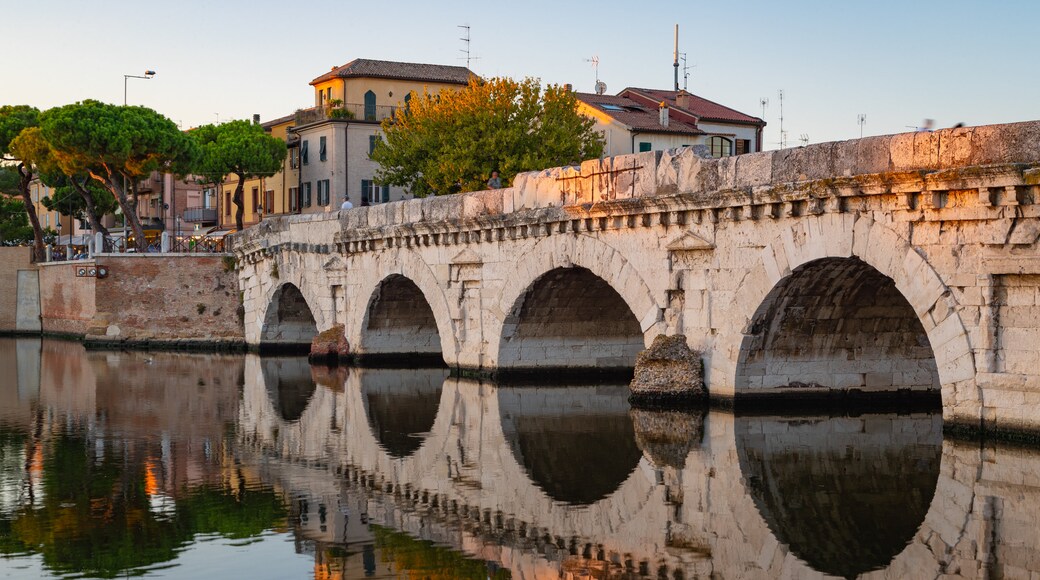 Tiberius Bridge which includes a sunset, a river or creek and a bridge