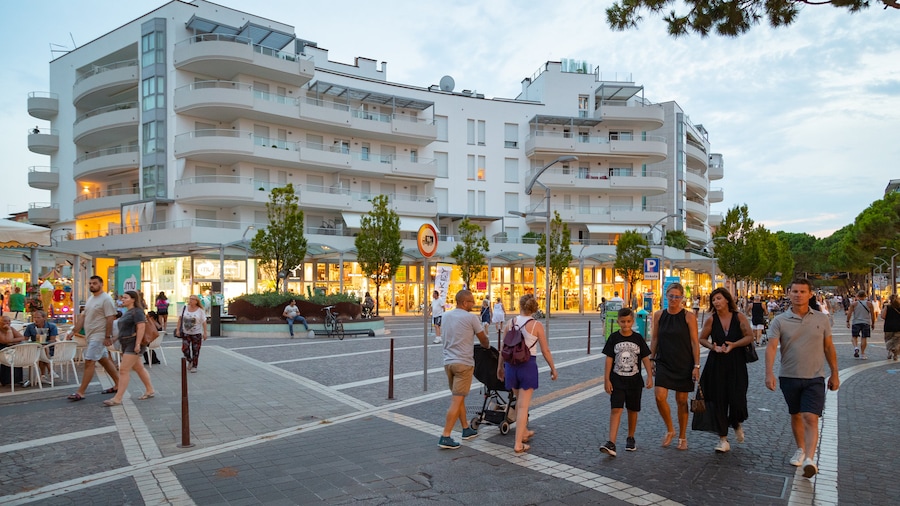 Jesolo showing street scenes as well as a small group of people
