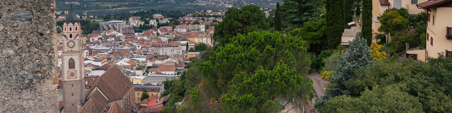Merano Historic Center featuring a small town or village, a sunset and landscape views