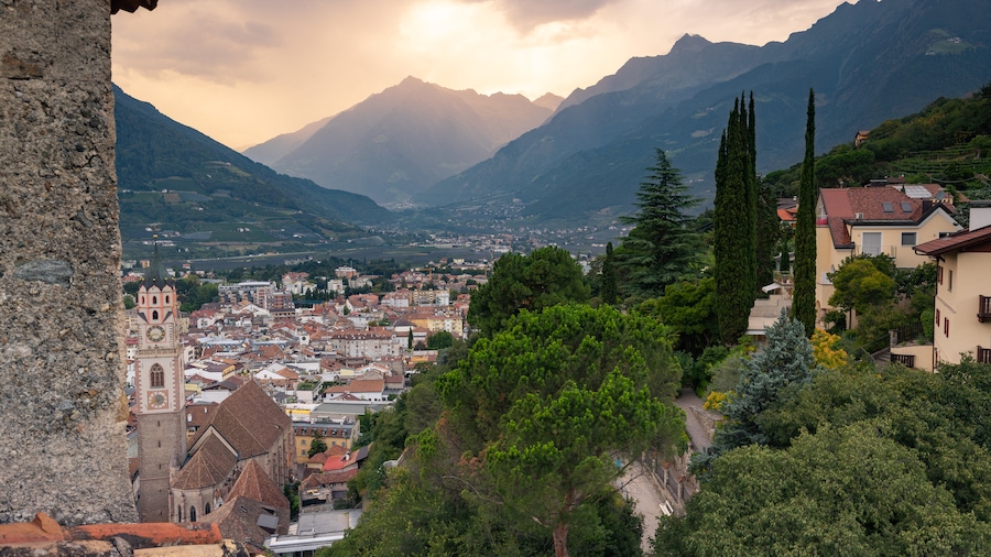 Merano Historic Center featuring a small town or village, a sunset and landscape views