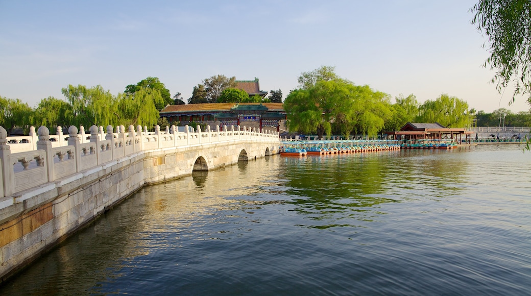 Beihai Park featuring a river or creek, a temple or place of worship and a bridge