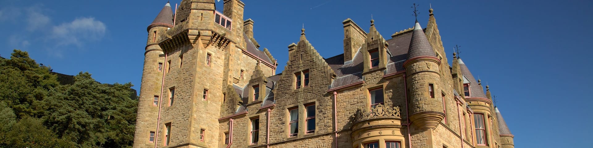 Belfast Castle which includes heritage architecture, a fountain and a castle
