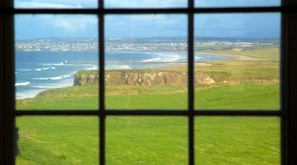 Mussenden Temple featuring rugged coastline, general coastal views and heritage architecture