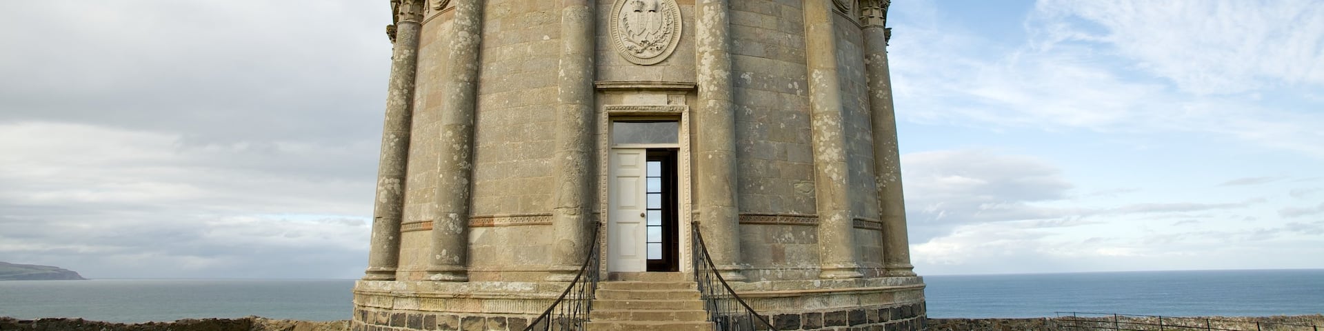 Mussenden Temple featuring a temple or place of worship and heritage elements