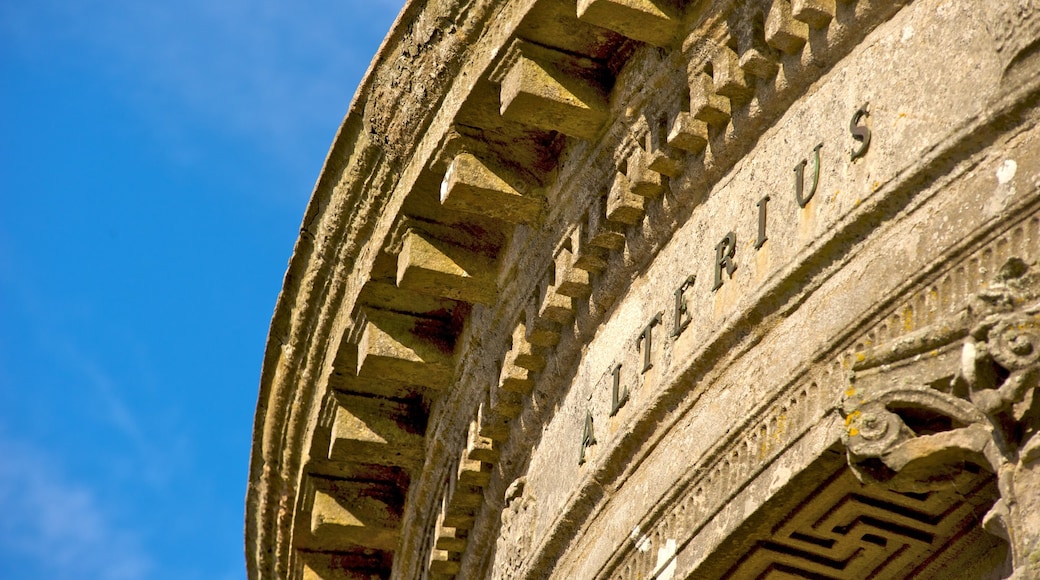 Mussenden Temple which includes signage, a temple or place of worship and heritage elements