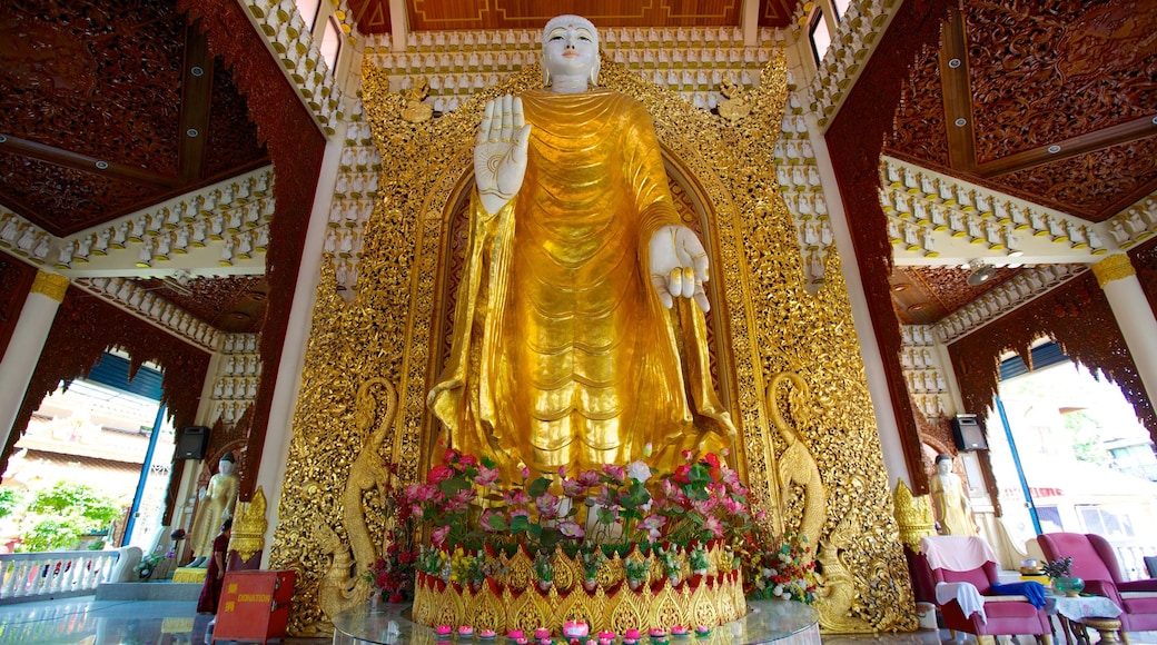 Templo budista Dhammikarama Burmese ofreciendo un templo o lugar de culto, elementos religiosos y vistas de interior