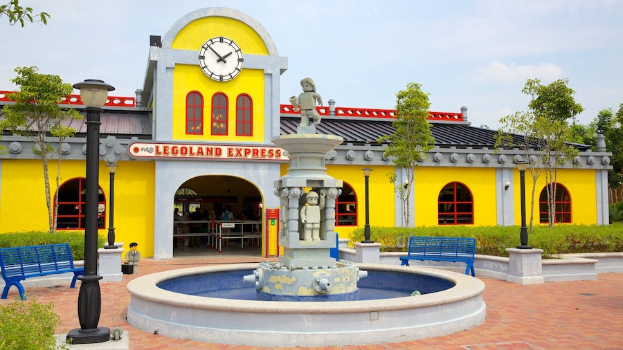 Johor Bahru which includes rides, a fountain and signage