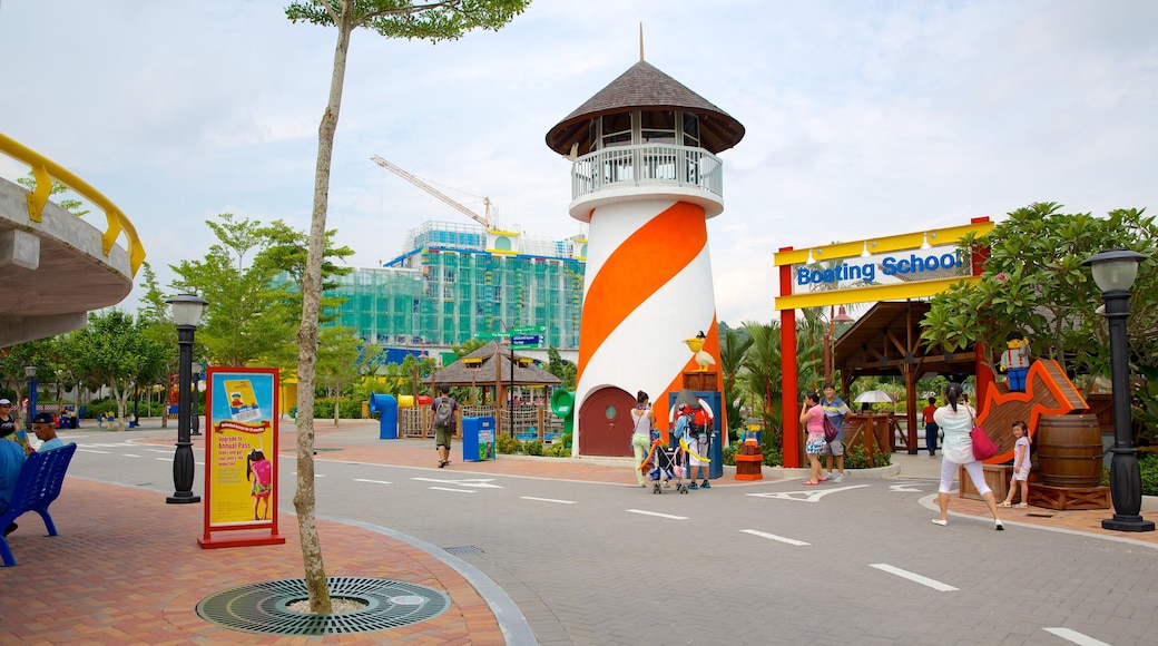 Johor Bahru featuring rides, signage and street scenes