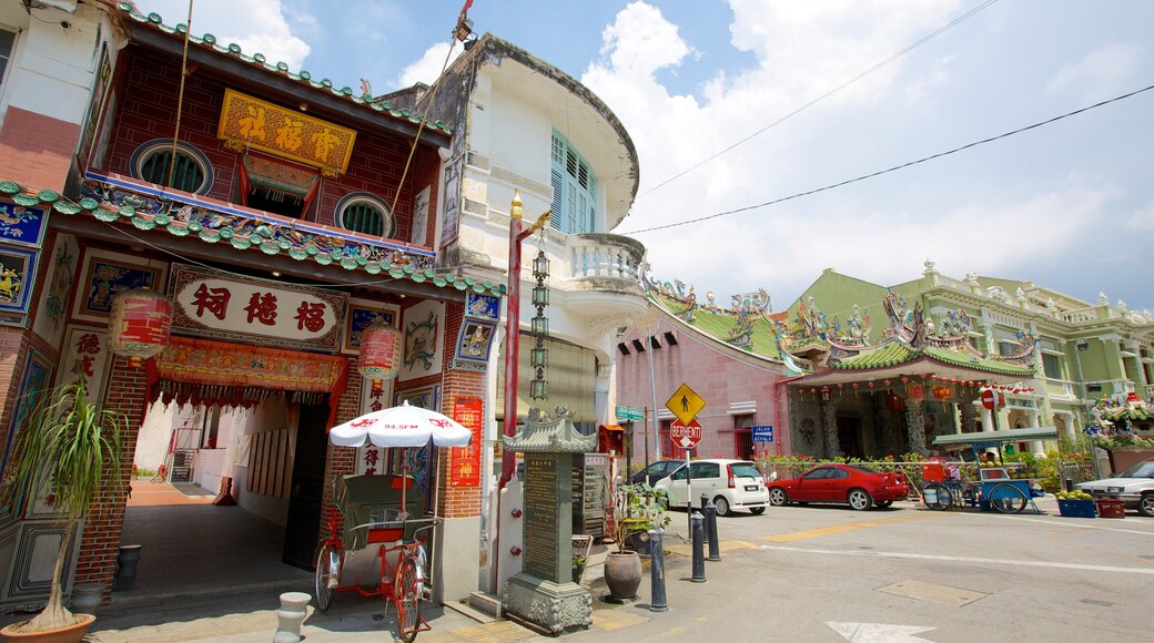 Penang which includes a small town or village and street scenes