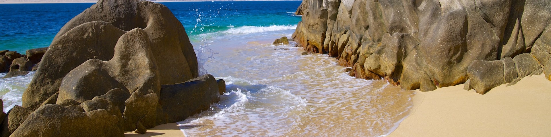 Playa del Amor showing rugged coastline and a beach