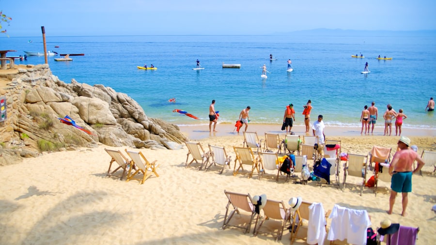 Las Caletas showing a beach and kayaking or canoeing as well as a large group of people