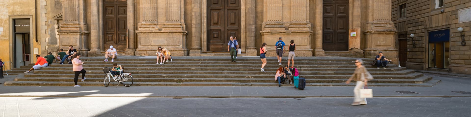 Duomo featuring heritage architecture and street scenes as well as a small group of people