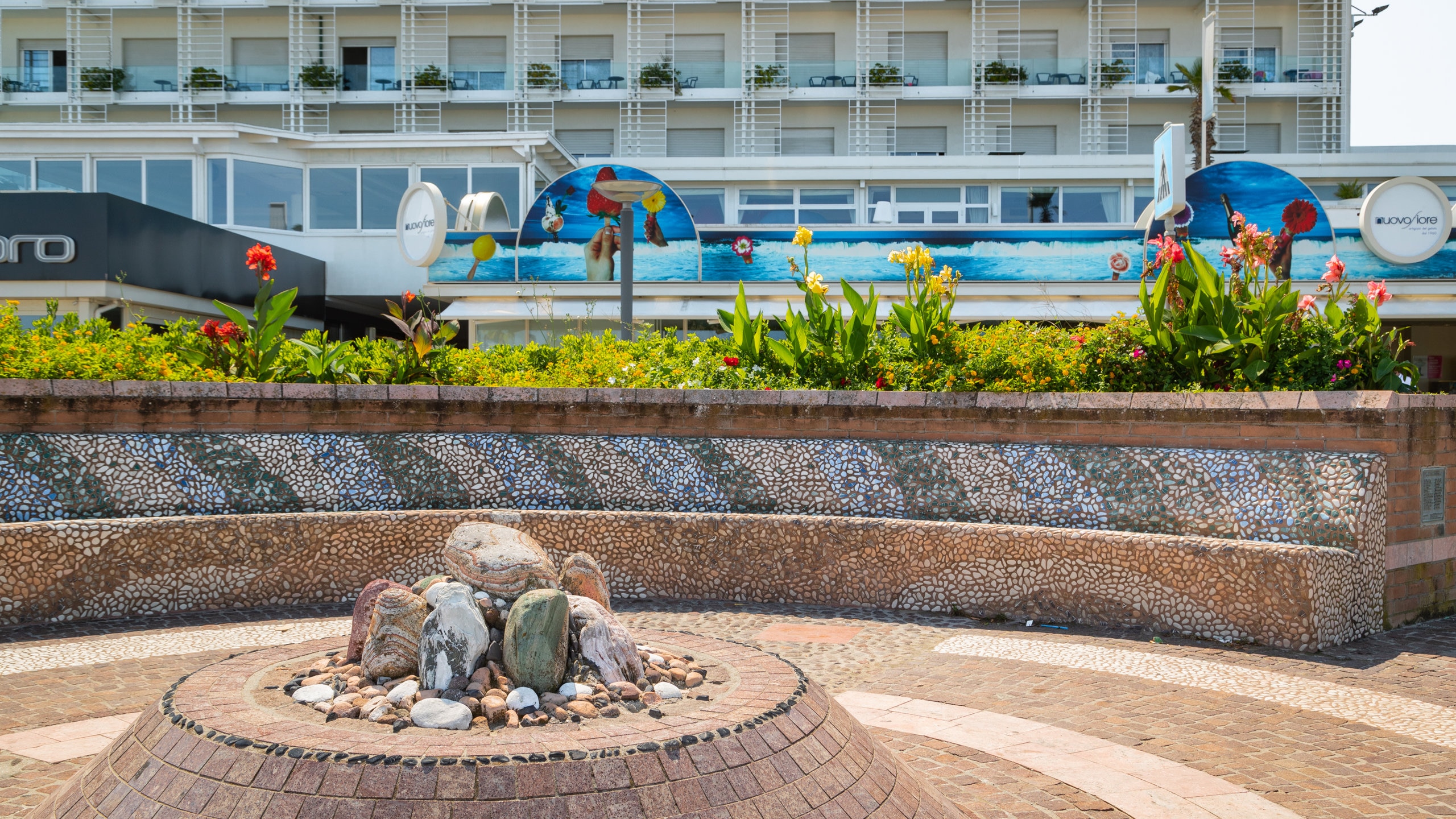 Attend an open-air music show or other performance at this seafront plaza, or visit when nothing is scheduled to admire the unique fountain.