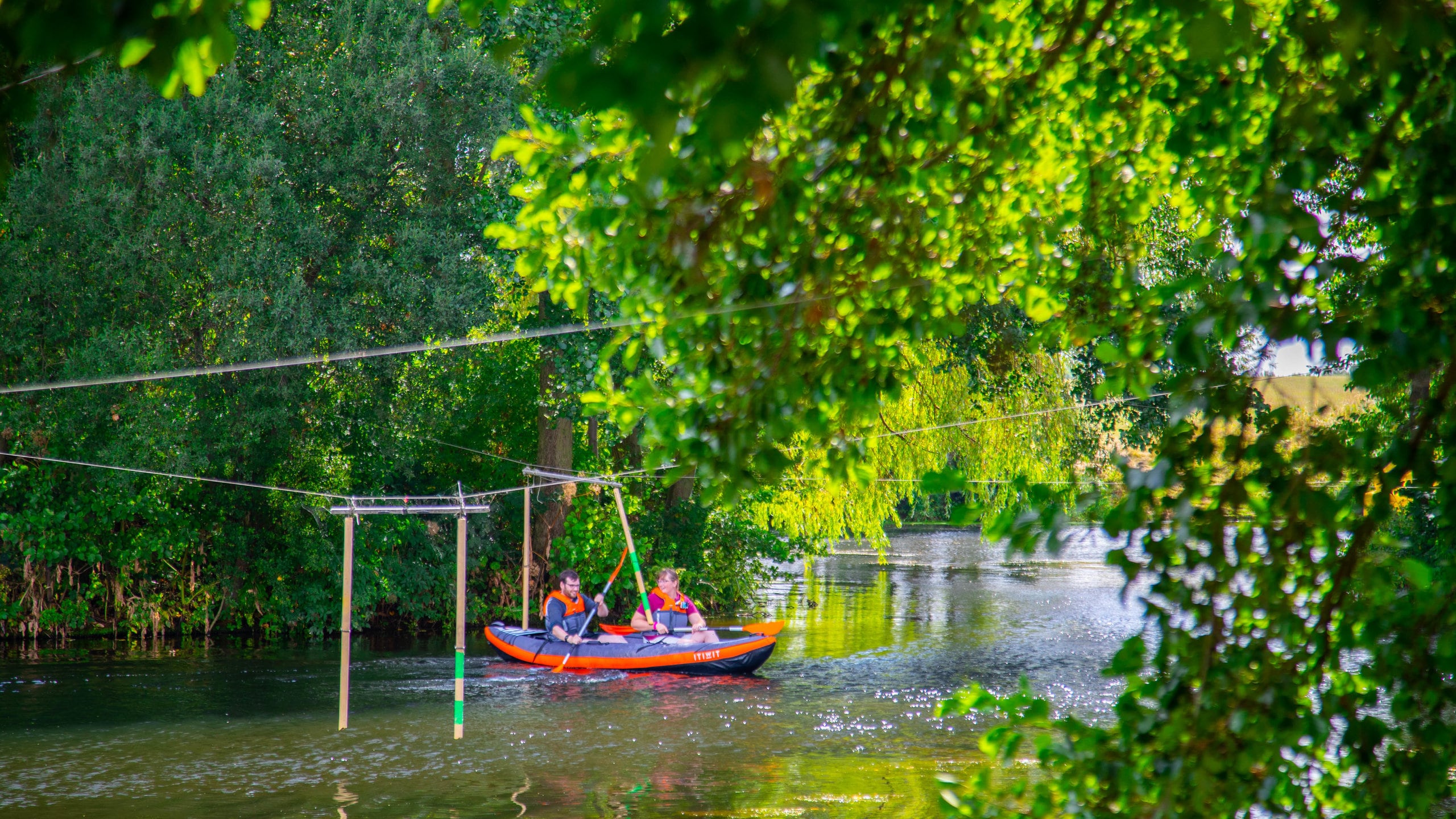 National Water Sports Centre featuring kayaking or canoeing and a river or creek as well as a couple