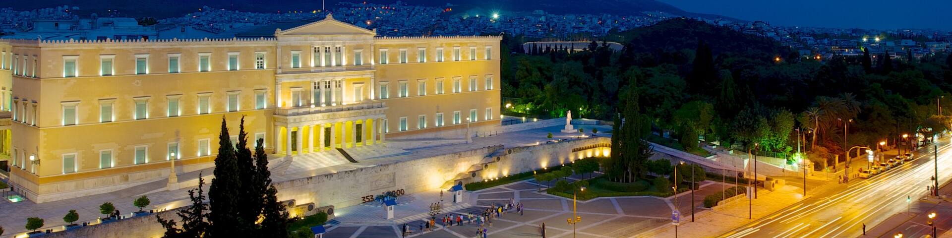 Syntagma Square which includes a city, night scenes and a square or plaza