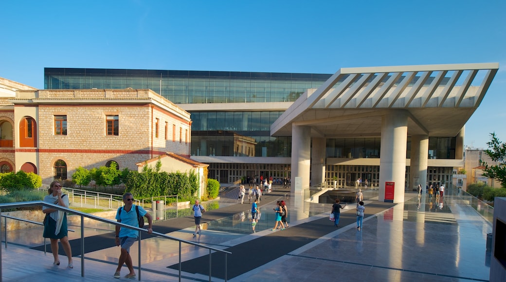 Acropolis Museum featuring a city as well as a large group of people