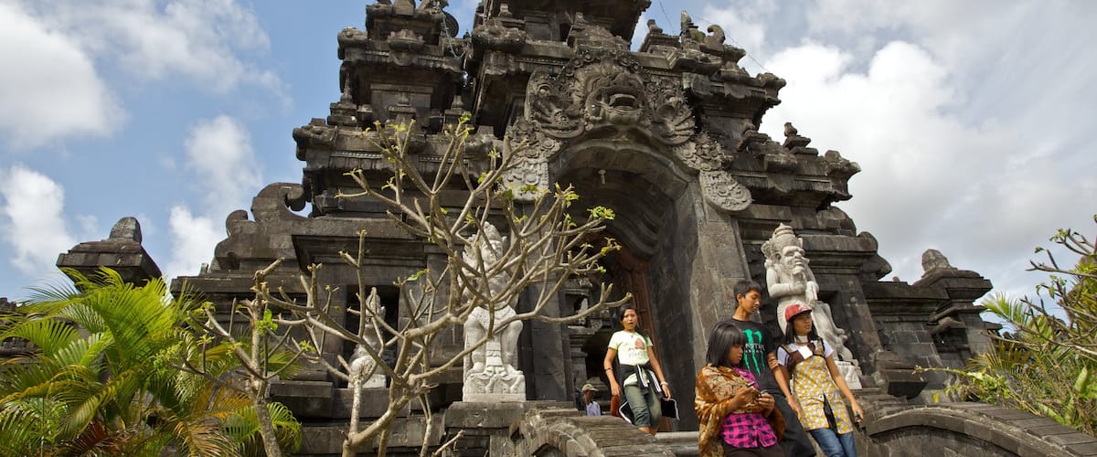 Bajra Sandhi Monument featuring religious elements and a temple or place of worship as well as a small group of people