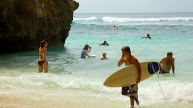 Uluwatu Beach which includes swimming, a beach and surfing