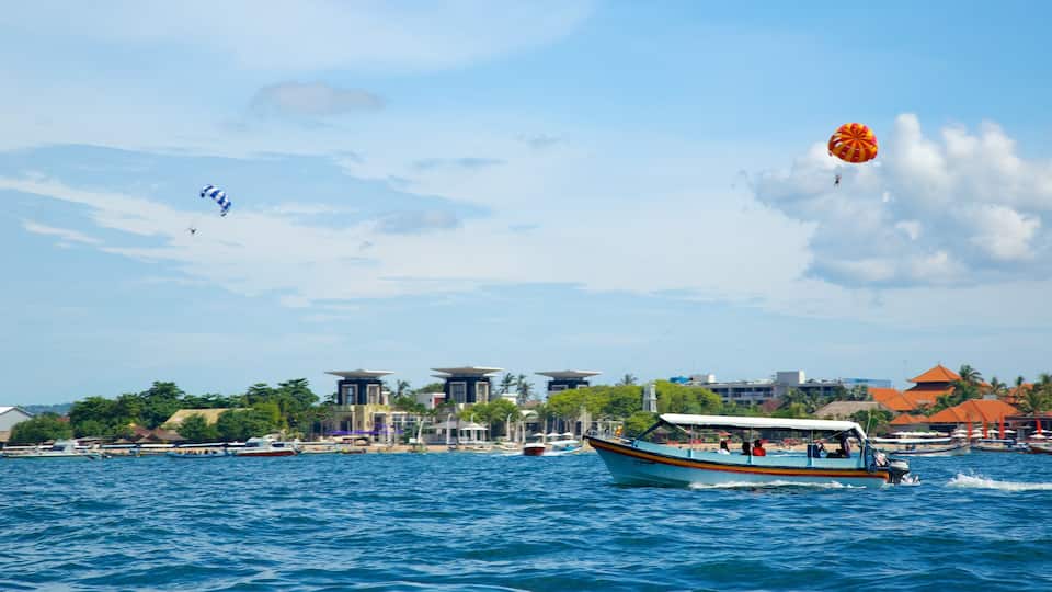 Turtle Island which includes waves, a coastal town and boating