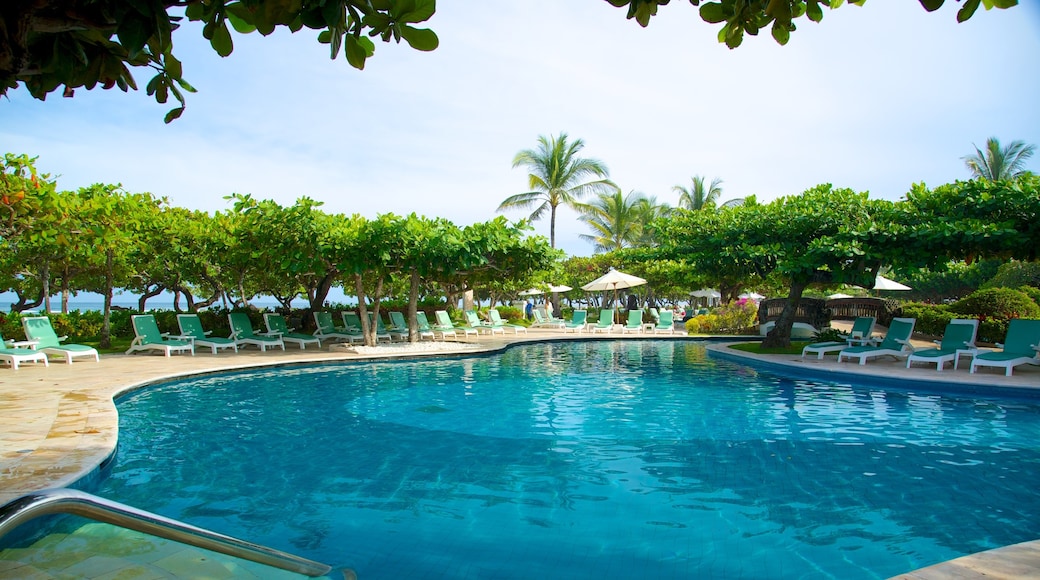 Nusa Dua Beach showing tropical scenes, a pool and a luxury hotel or resort