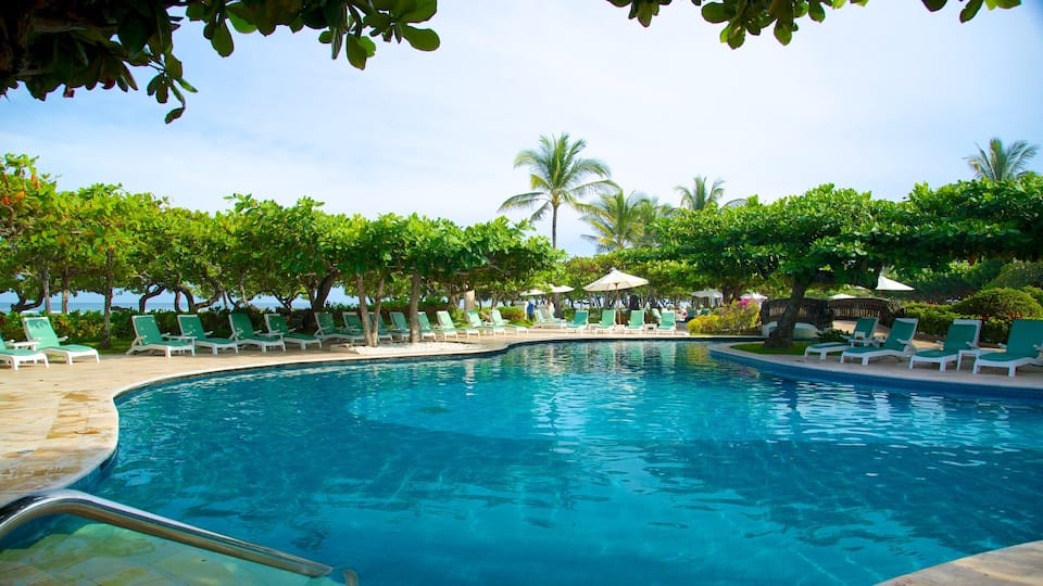 Nusa Dua Beach which includes tropical scenes, a luxury hotel or resort and a pool