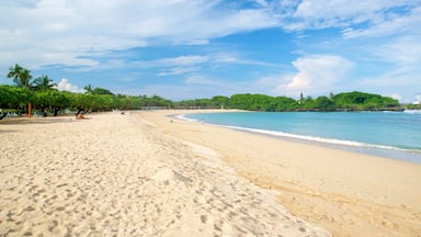 Nusa Dua Beach which includes a sandy beach and tropical scenes